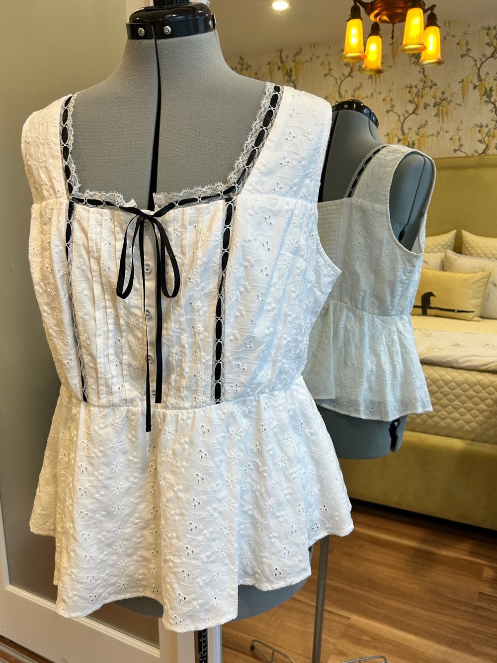 Torrid White Eyelet Peplum Tank Top with Black Ribbon Detailing